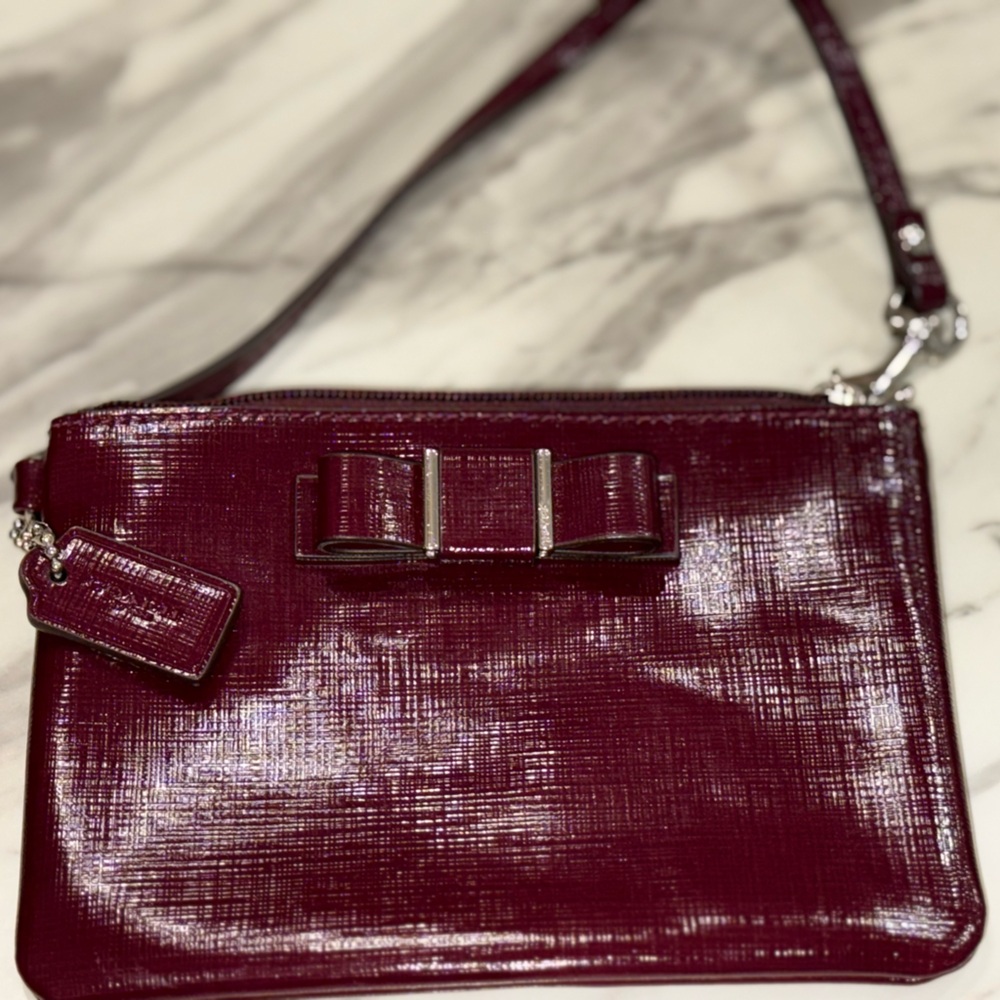 COACH Darcy Patent Bow Small Wristlet Handbag in Sherry